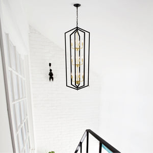 Modern black and gold geometric pendant chandelier with 12 candle-style LED lights, perfect for illuminating dining rooms with an elegant and contemporary design – available at Boltbuy.com