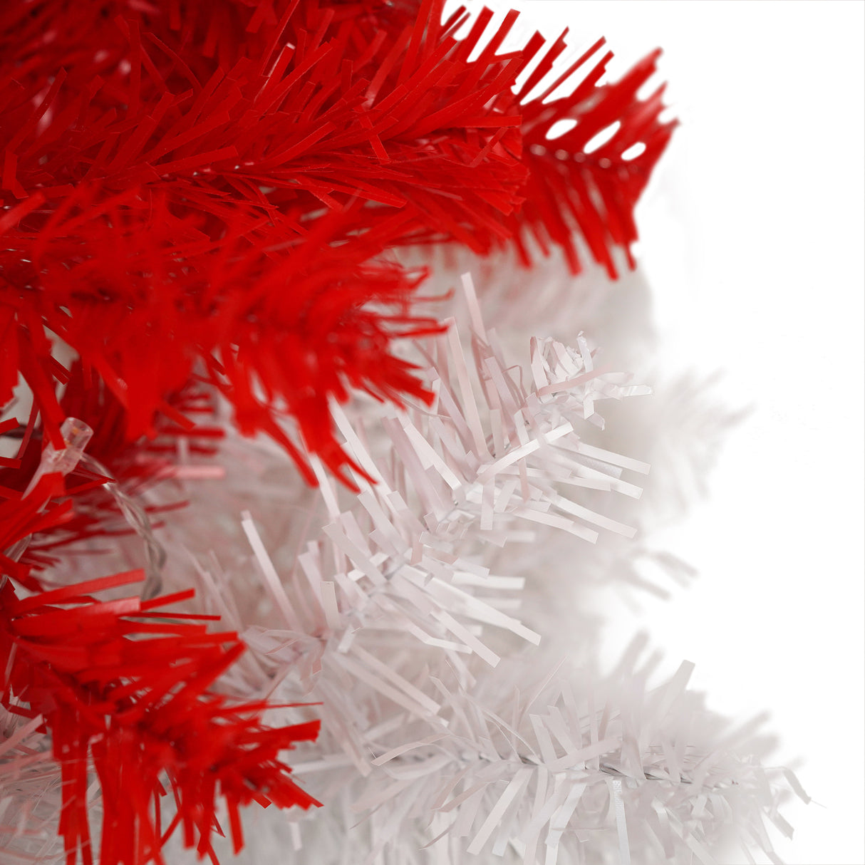 Festive red and white LED Christmas tree for indoor holiday decor, featuring vibrant lights and a unique snow-topped design, perfect for creating a warm, joyful atmosphere in your living room or near the fireplace. Shop at Boltbuy.com for elegant Christmas decorations