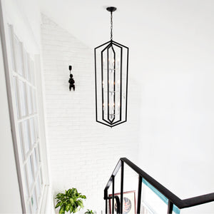 Modern black and silver 12-light geometric chandelier for dining rooms. Sleek LED & Lighting design with a unique cage frame, ideal for high ceilings. Perfect for creating elegant dining spaces. Available now at BoltBuy.com.