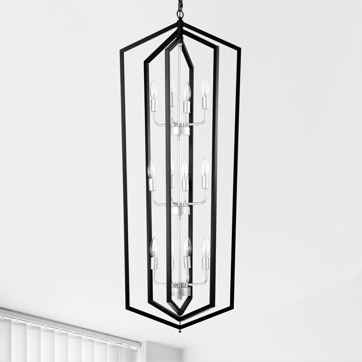 Modern black and silver 12-light geometric chandelier for dining rooms. Sleek LED & Lighting design with a unique cage frame, ideal for high ceilings. Perfect for creating elegant dining spaces. Available now at BoltBuy.com.