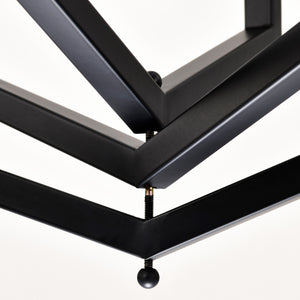 Modern black and silver 12-light geometric chandelier for dining rooms. Sleek LED & Lighting design with a unique cage frame, ideal for high ceilings. Perfect for creating elegant dining spaces. Available now at BoltBuy.com.